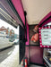 Side view of 32 inch high brightness digital signage display installed in retail shop window