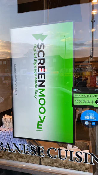 Moove 32 inch high brightness digital signage display installed in restaurant shop window