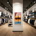ScreenMoove SM43C-L 43 inch portrait digital signage display installed in a fashion retail store for promotional and advertising content